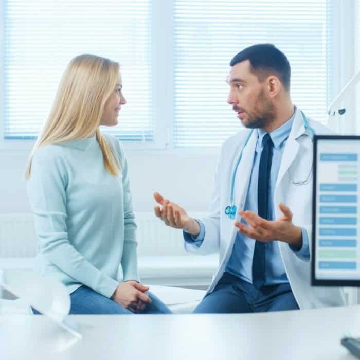 Patient asking cosmetic surgery questions to cosmetic surgeon. 